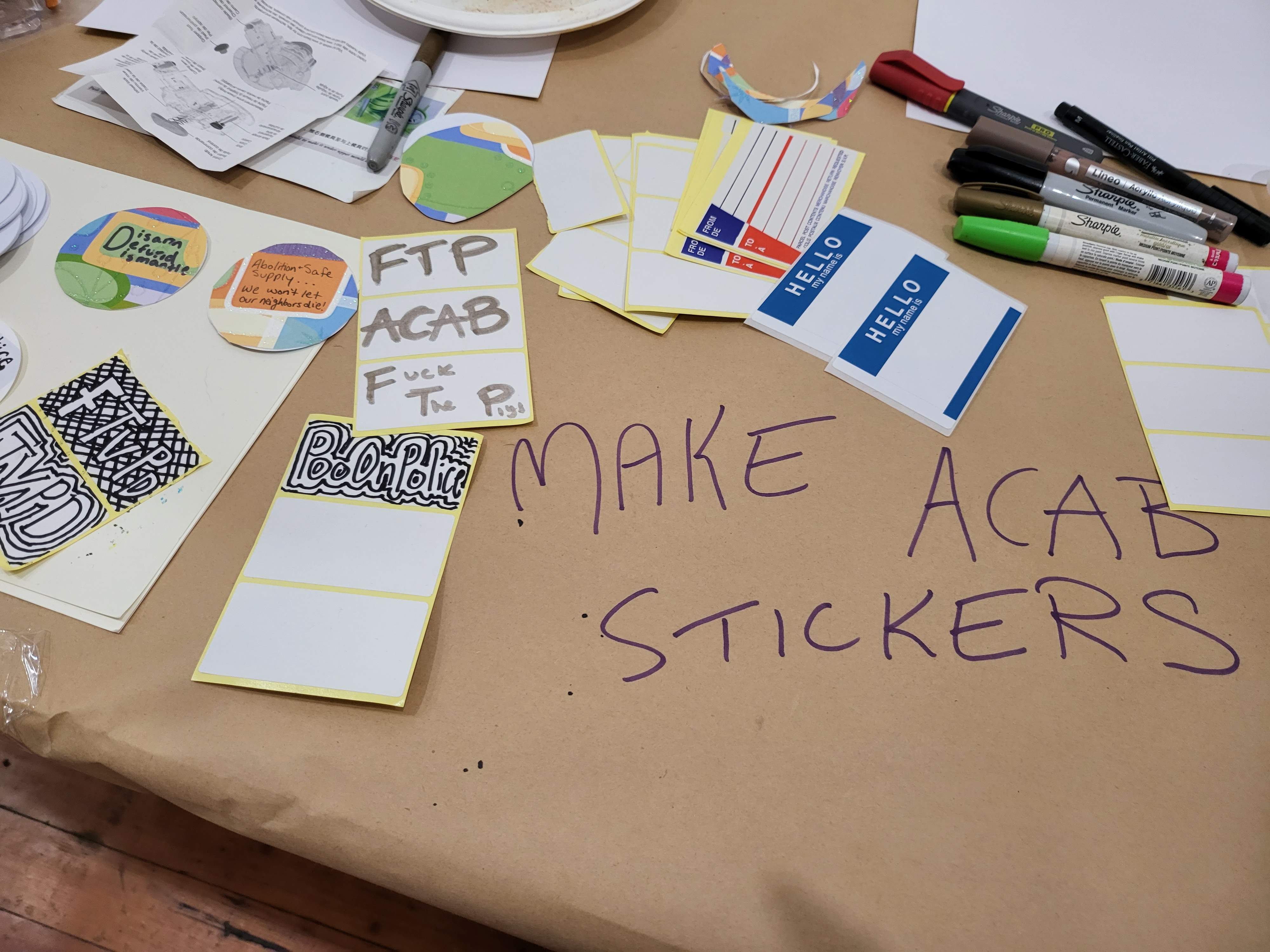 ACAB sticker making table.
