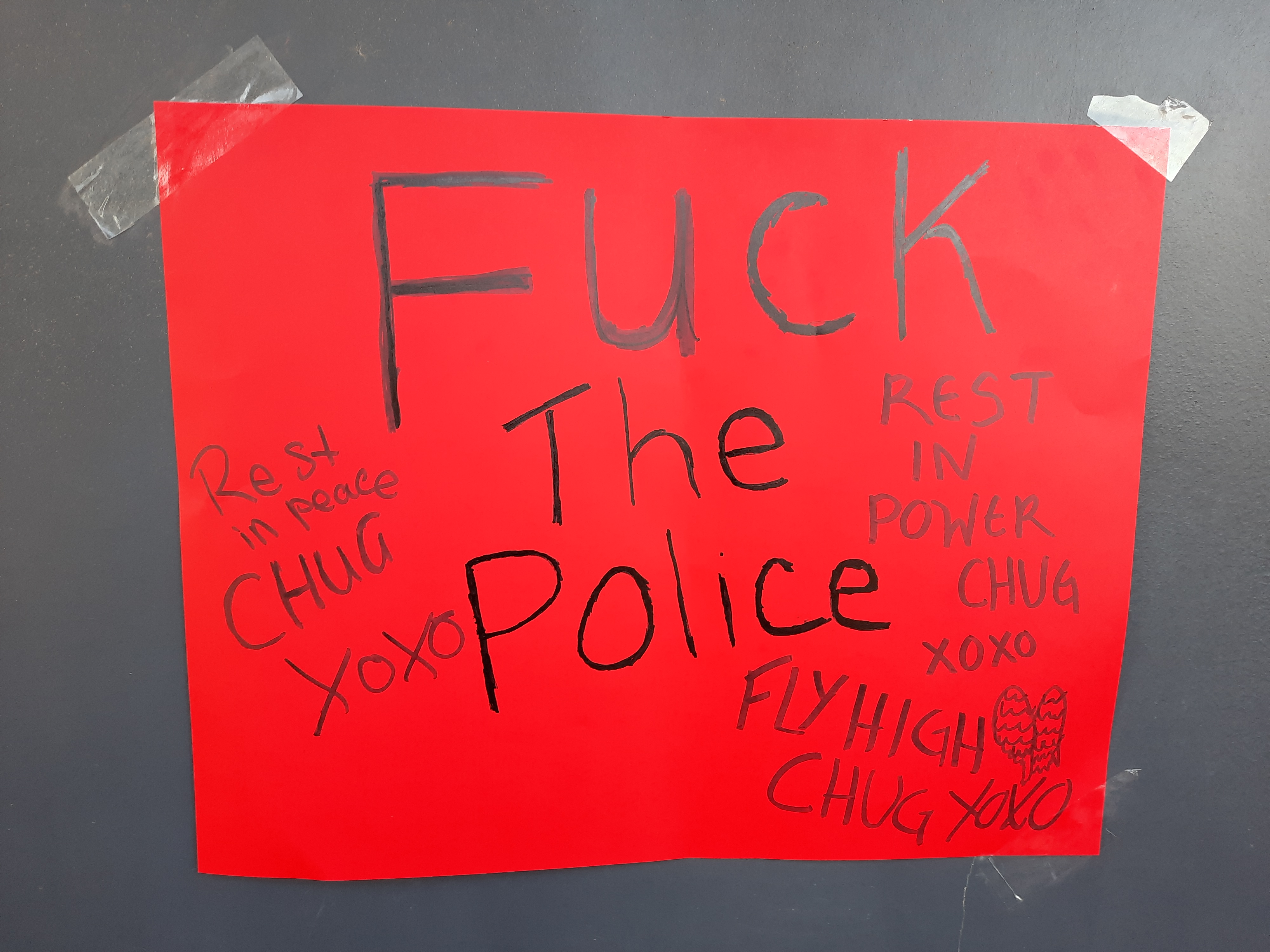 Memorial poster for Chug Norman. Poster saying Fuck the Police. Rest in Power. Fly high Chug.