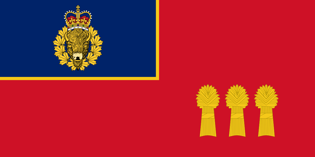 RCMP F Division Flag. Red background with three wheat sheaves. Blue box in upper left corner with RCMP buffalo and crown crest. 