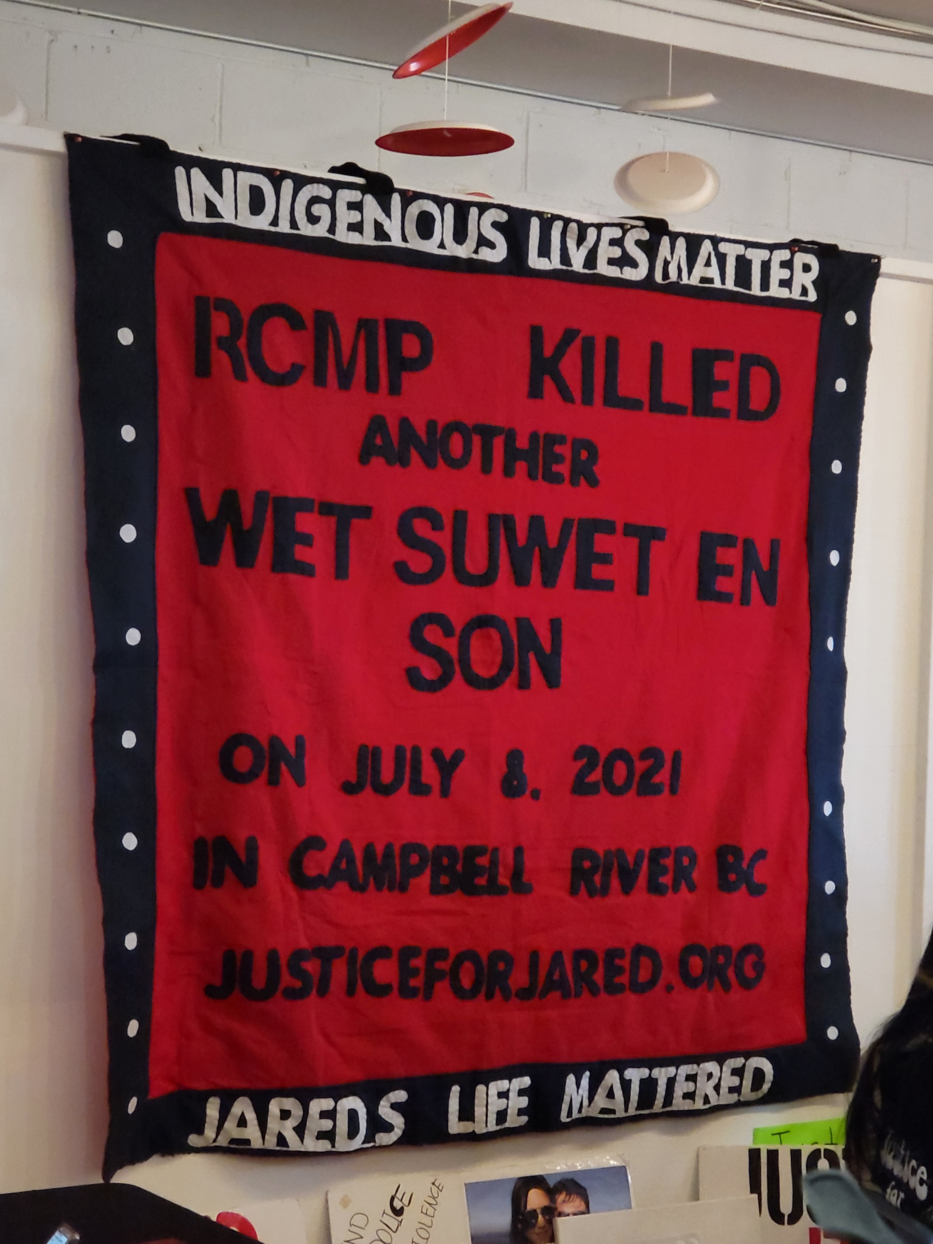Justice for Jared banner on wall. 