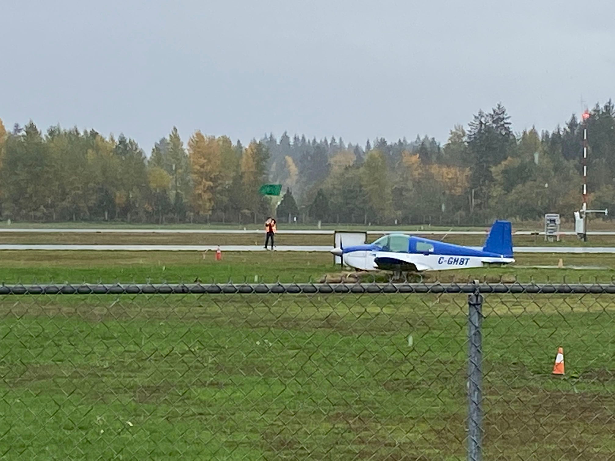 Land Defender blocking runway in Nanaimo. Photo Credit: Extinction Rebellion Nanaimo