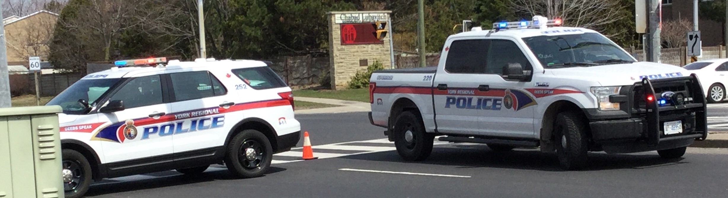York Regional Police vehicles parked at scene in road.