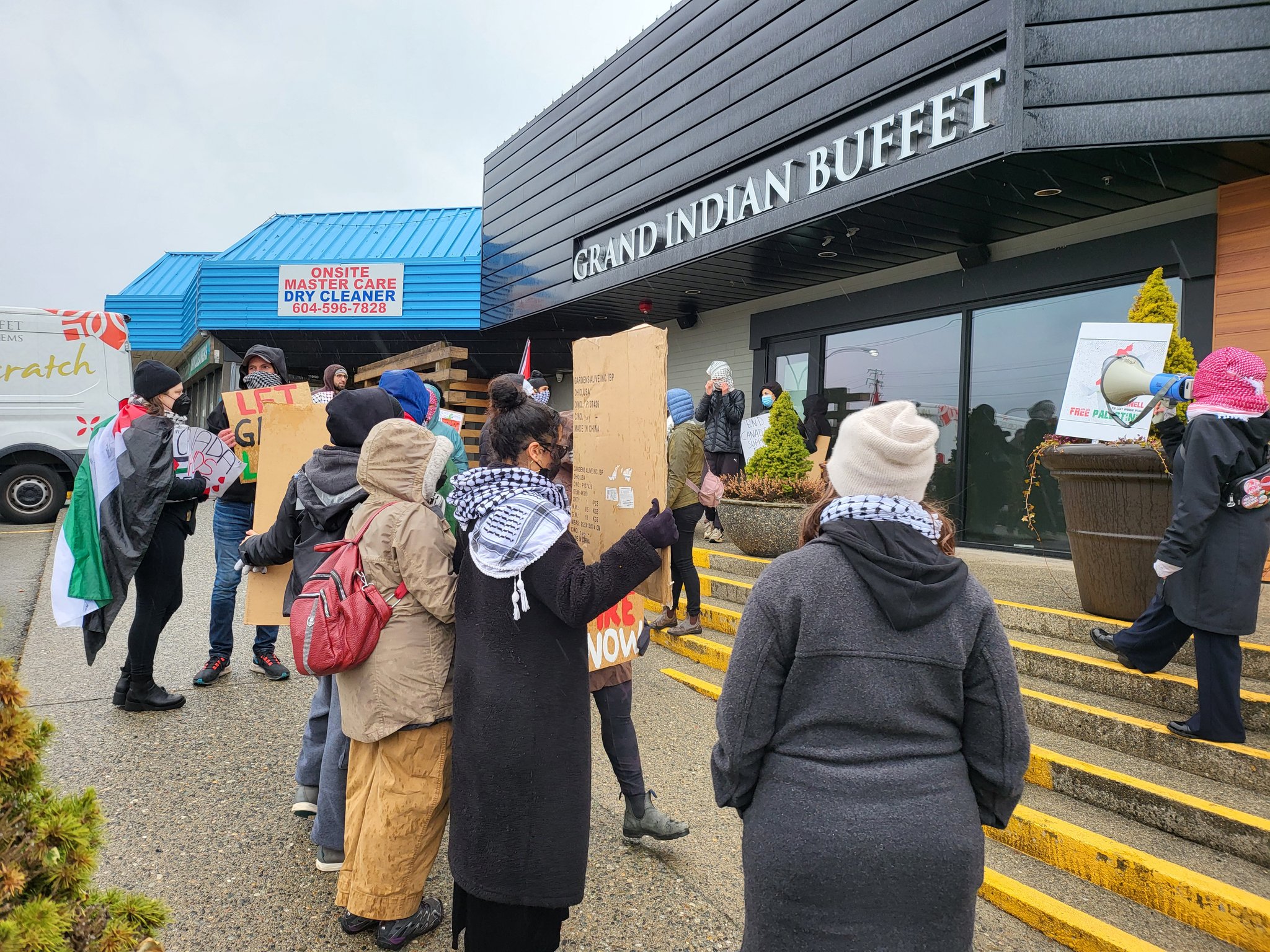 Protest outside restaurant. 