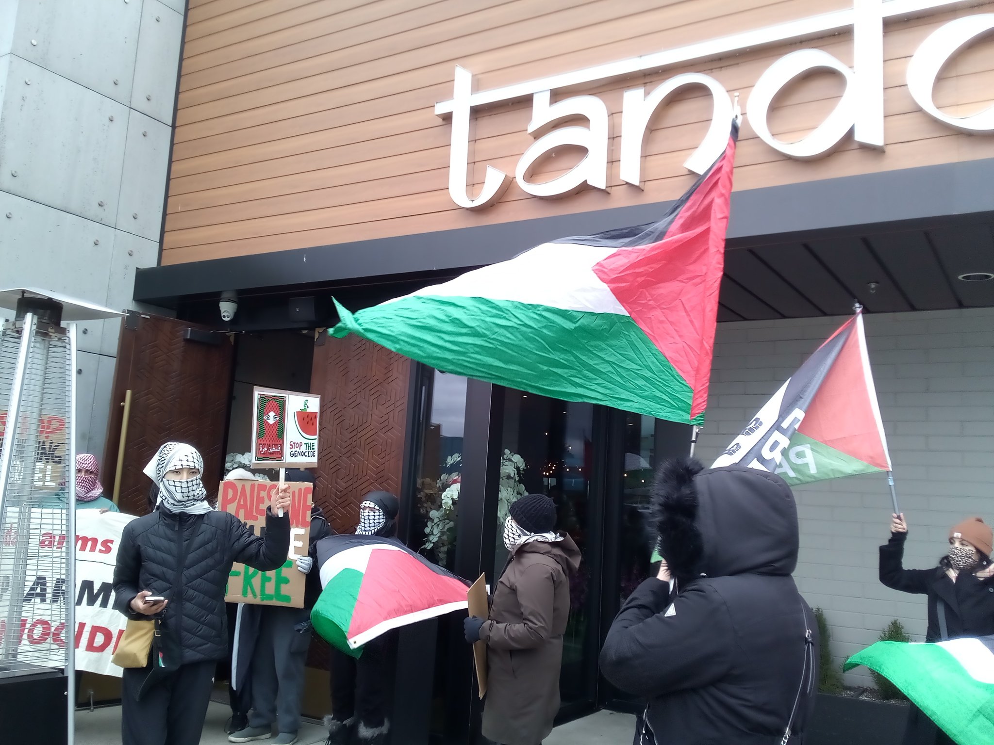 Protest outside restaurant.