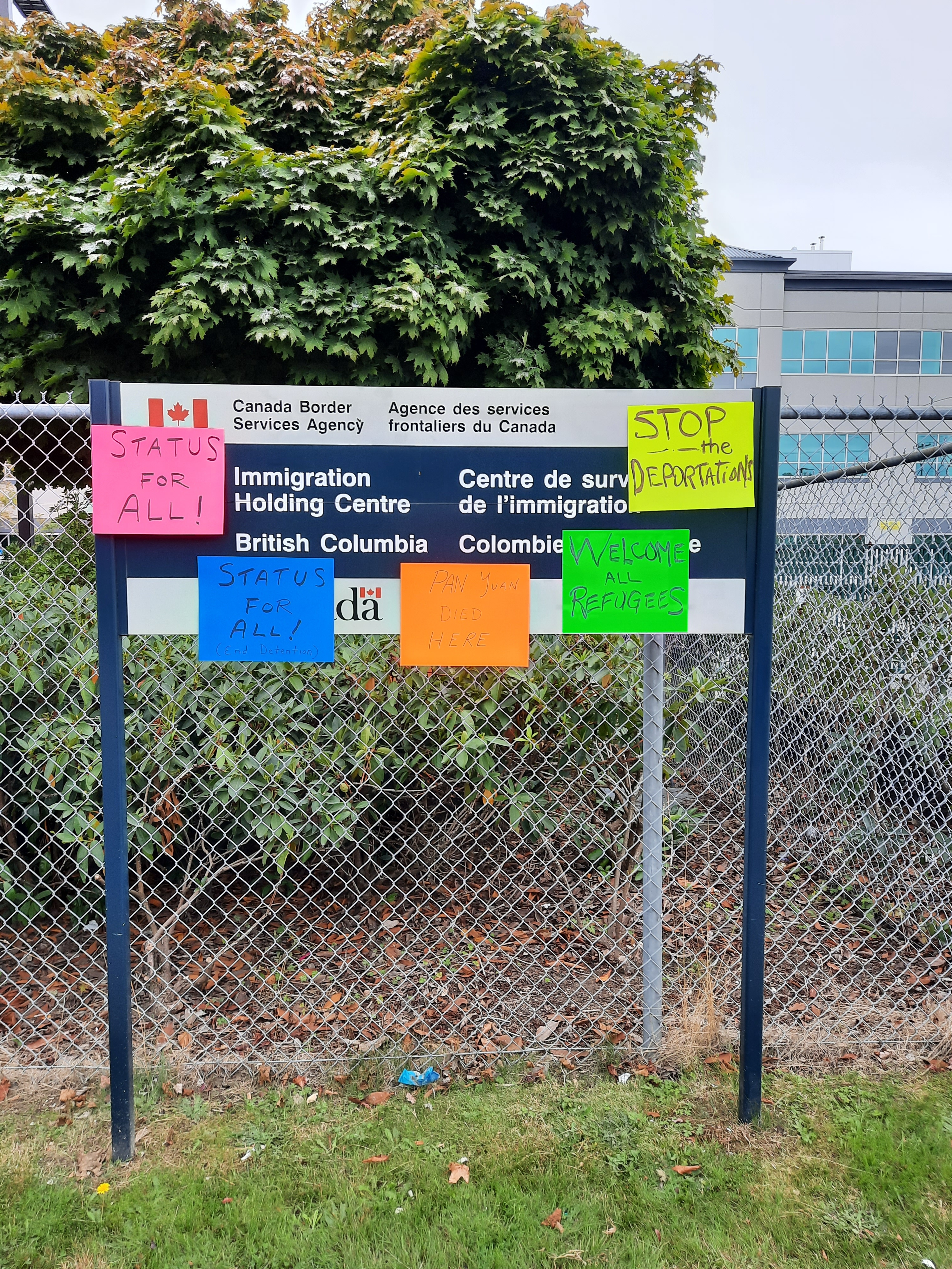 Status for all posters on migrant detention sign in Surrey.