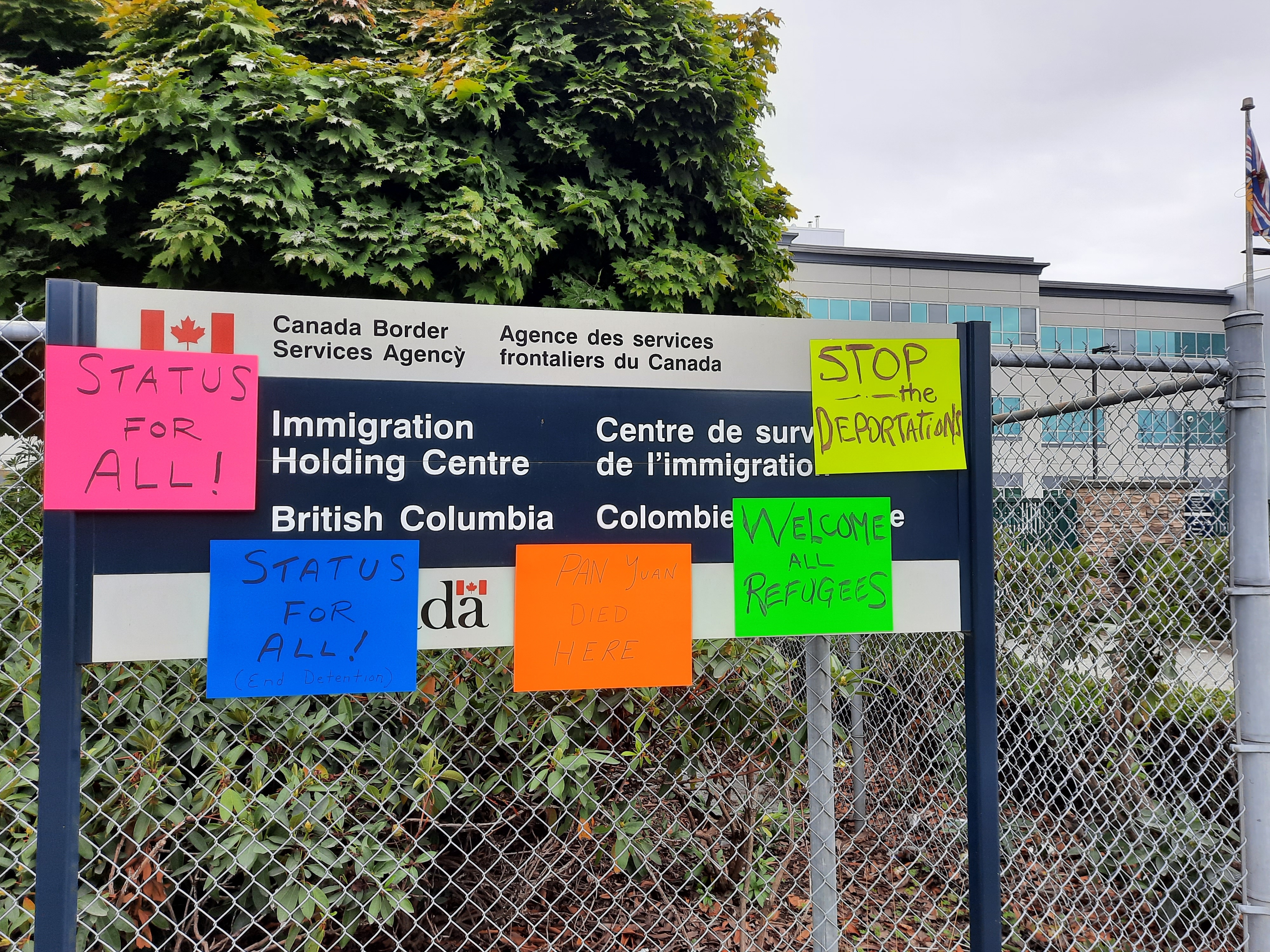 Status for all posters on migrant detention sign in Surrey.