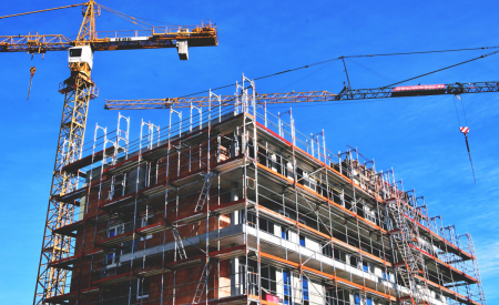 An apartment building that is under construction. (Public domain, from PXHere.)