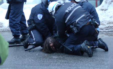 Several police on top of person on the ground
