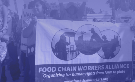 Food Chain Workers Alliance members holding a banner at a demonstration. Photo: FCWA