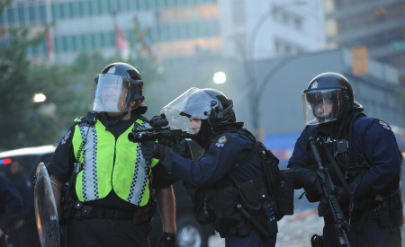 VPD anti-riot squad with weapons.