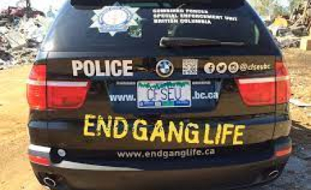 Police car with "End Gang Life" painted on it.