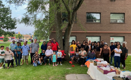 Tenants of 1570 Lawrence Ave. W. gather for a potluck to celebrate their victory at the Ontario Landlord and Tenant Board