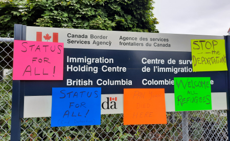 Status for all posters on migrant detention sign in Surrey.